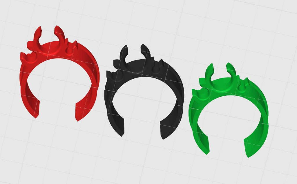 Red, black, and green 3D printed kart cable clips in a row showing the clip opening on a gray background