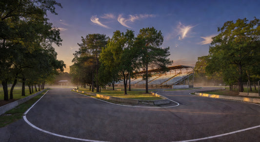 Paved sprint kart track at dusk, evoking race-ready atmosphere.