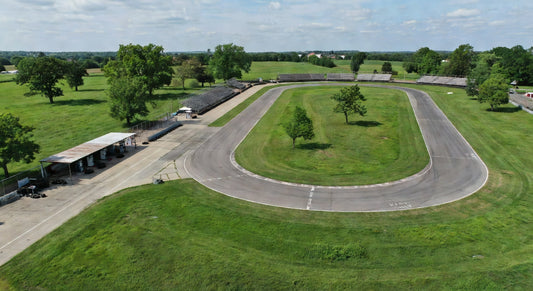 Midwest karting track landscape with paved oval and green surroundings