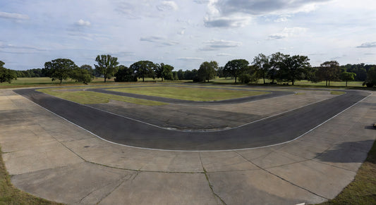 Wide landscape of paved kart racing track in Midwest setting