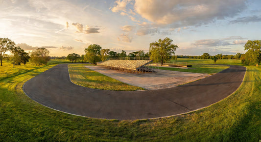 Wide scenic view of a Midwest kart racing track at golden hour, ready for LO206 action.