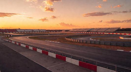 Paved sprint kart track bathed in sunset light, evoking race-ready anticipation.