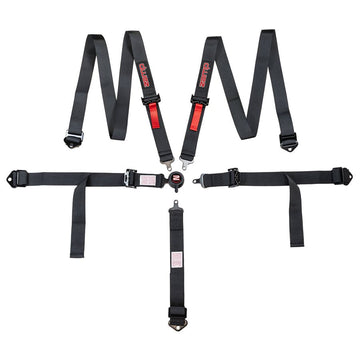 Second full view of Zamp youth 5 point seat harness spread flat with emphasis on metal end fittings, red shoulder adjusters, and steel hardware on a white background