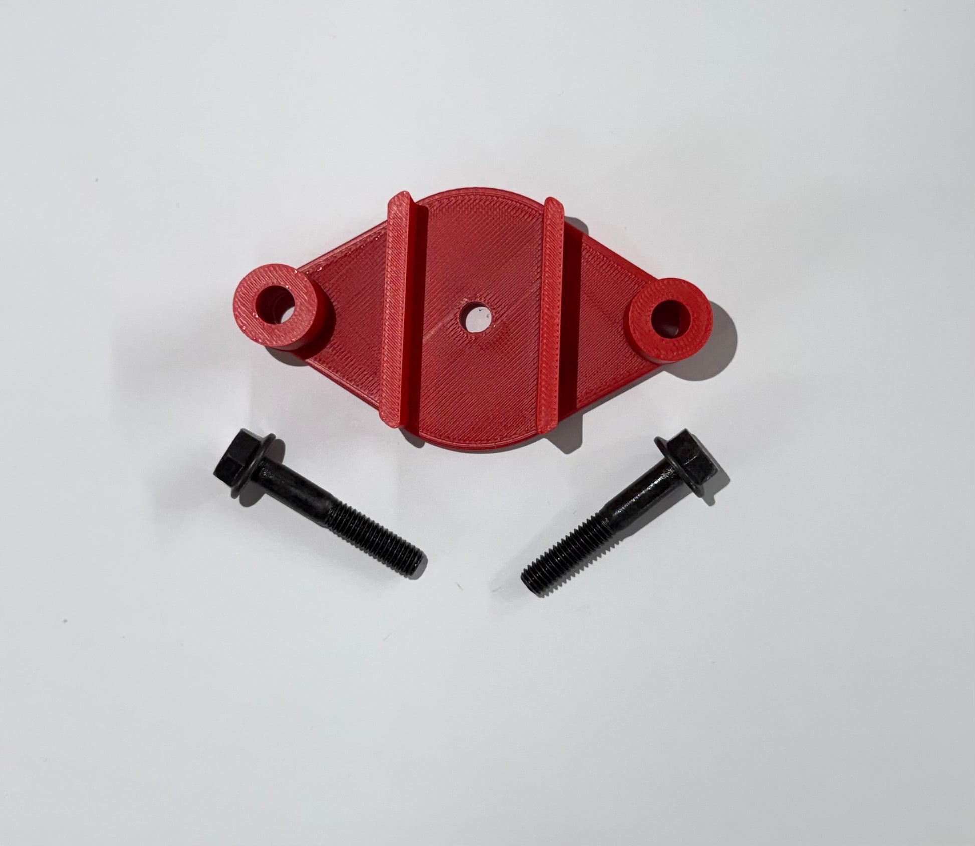 Red 3D printed JK-FPR Fuel Pump Riser with included black 6mm hardware bolts