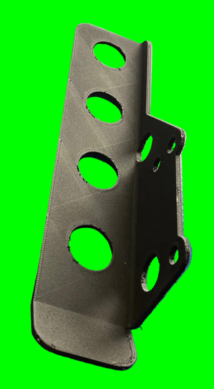 View of underside of chainguard on a neon green background. Shows the bolt holes for mounting, and holes inside of chain guard for light weight.
