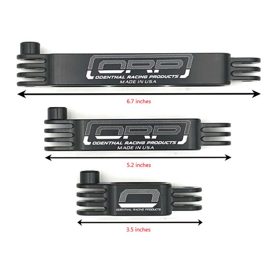 Three arms from a odenthal camera mount, different sizes. Each size has a label under it. 6.7 inches, 5.2 inches, and 3.5 inches. Each arm is black and has brackets on the end to connect to one another. Also has the ORP logo it, they are all black on a white background.