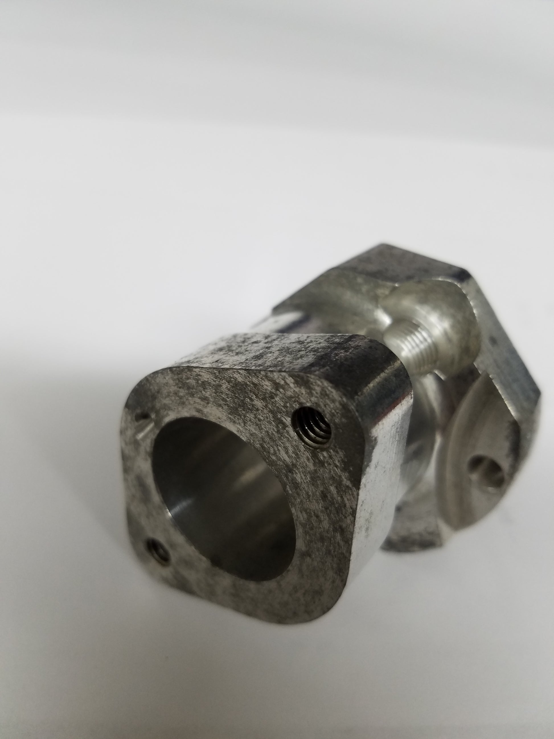 Silver Tillotson carb manifold TRM-S installed on Raptor flathead