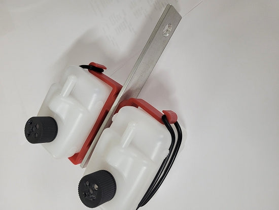 Dual catch tank assembly mounted on kart rear bearing hanger