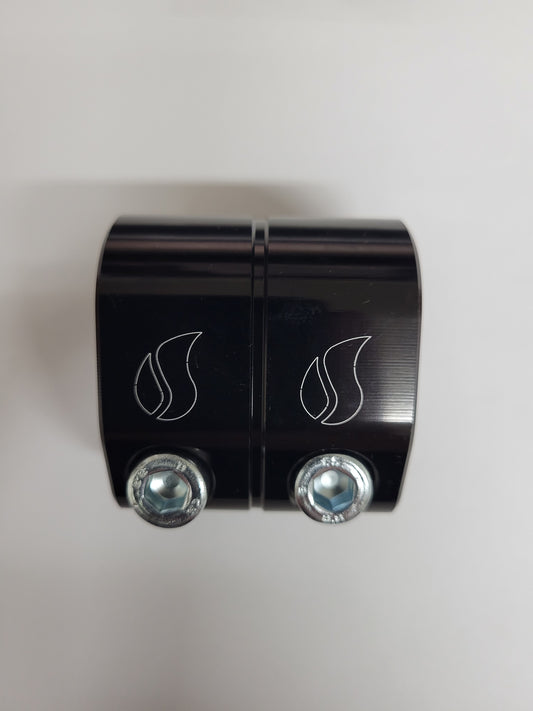 Black torsion bar clamp securing kart suspension tubing