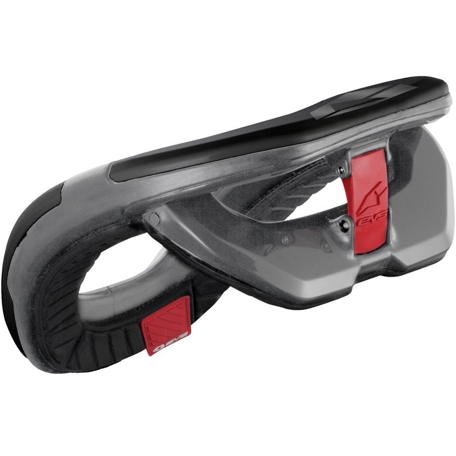Side profile of the EVS R-4 youth neck support highlighting the contoured shoulder wing, red accent panel with EVS logo, textured foam base and low-profile construction on a white background