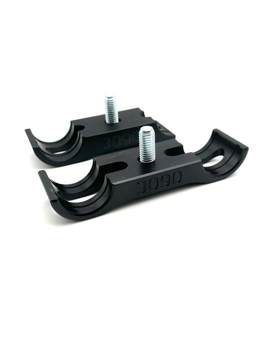 Pair of black Euro style cradling motor mount clamps with curved cradling ends, two silver bolts per unit, and engraved 3090 sizing on a white background