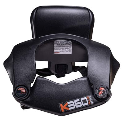 Overhead view into neck opening of black K360 Plus kids neck brace with visible safety labels and molded collar shape for smaller racers on a white background