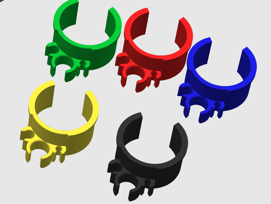 Five 3D printed kart cable management clips in green, red, blue, yellow and black arranged on a gray background