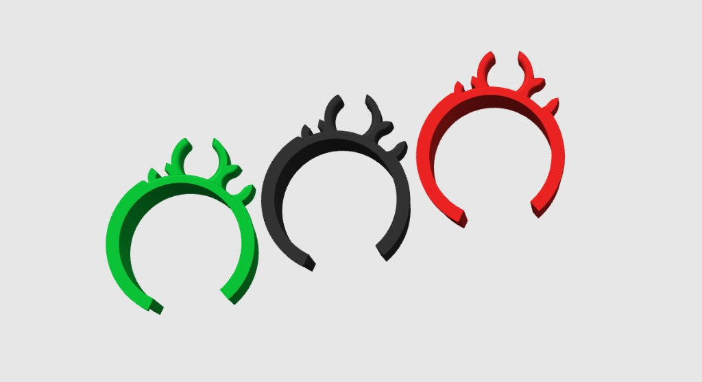 Green, black, and red PETG kart frame clips viewed from above showing the fuel line and cable slots on a gray background