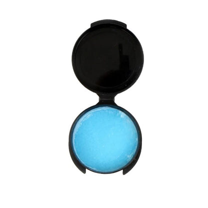 Open black container showing bright blue K-Klear anti-fog gel inside on a white background