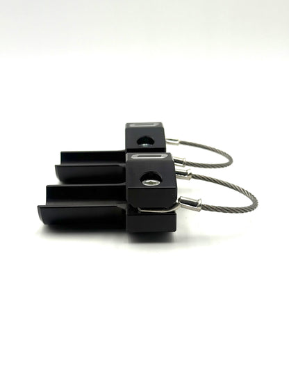 Side view of stacked black EZBR rear bumper safety clamps highlighting machined pockets bolts and logo on a white background