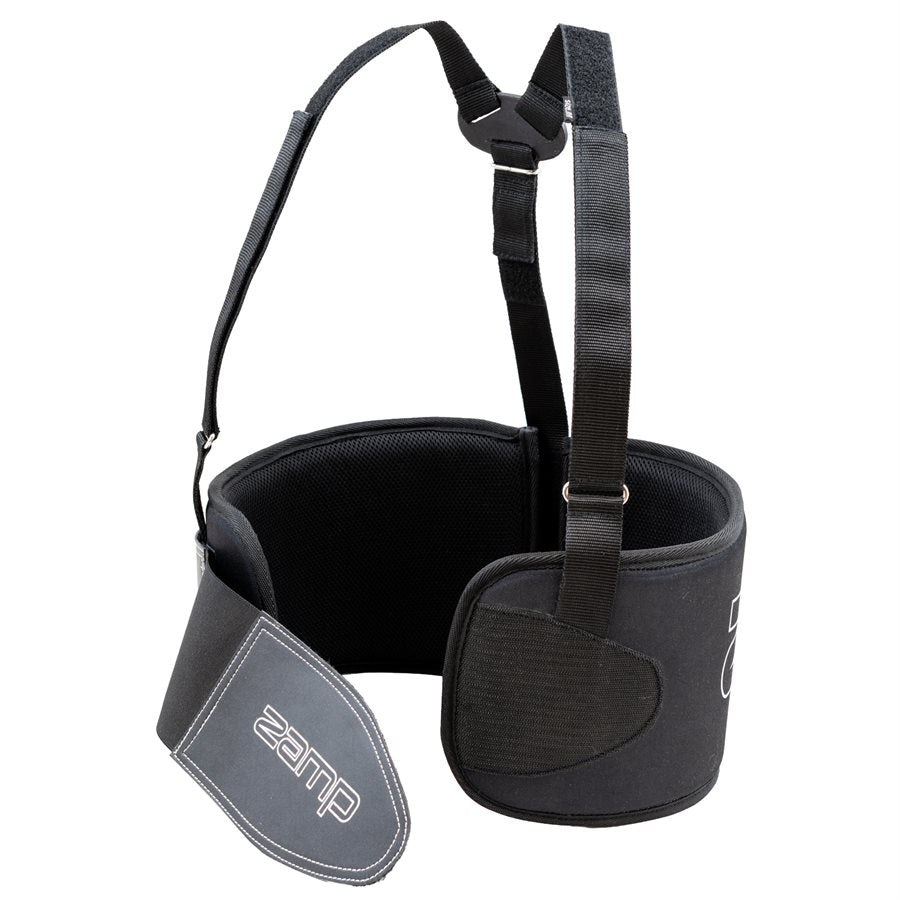 Side and partial rear view of black Zamp rib protector displaying logo on adjustable flap breathable mesh and harness points on a white background