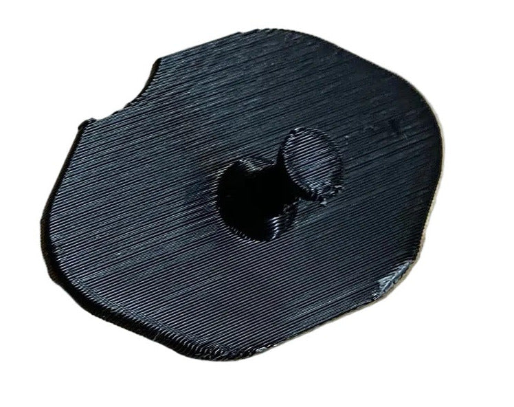 Lo206 exhaust port cover/cap on white background showing the side that has the grab able pin sticking up that you can grab with your fingers to remove.
