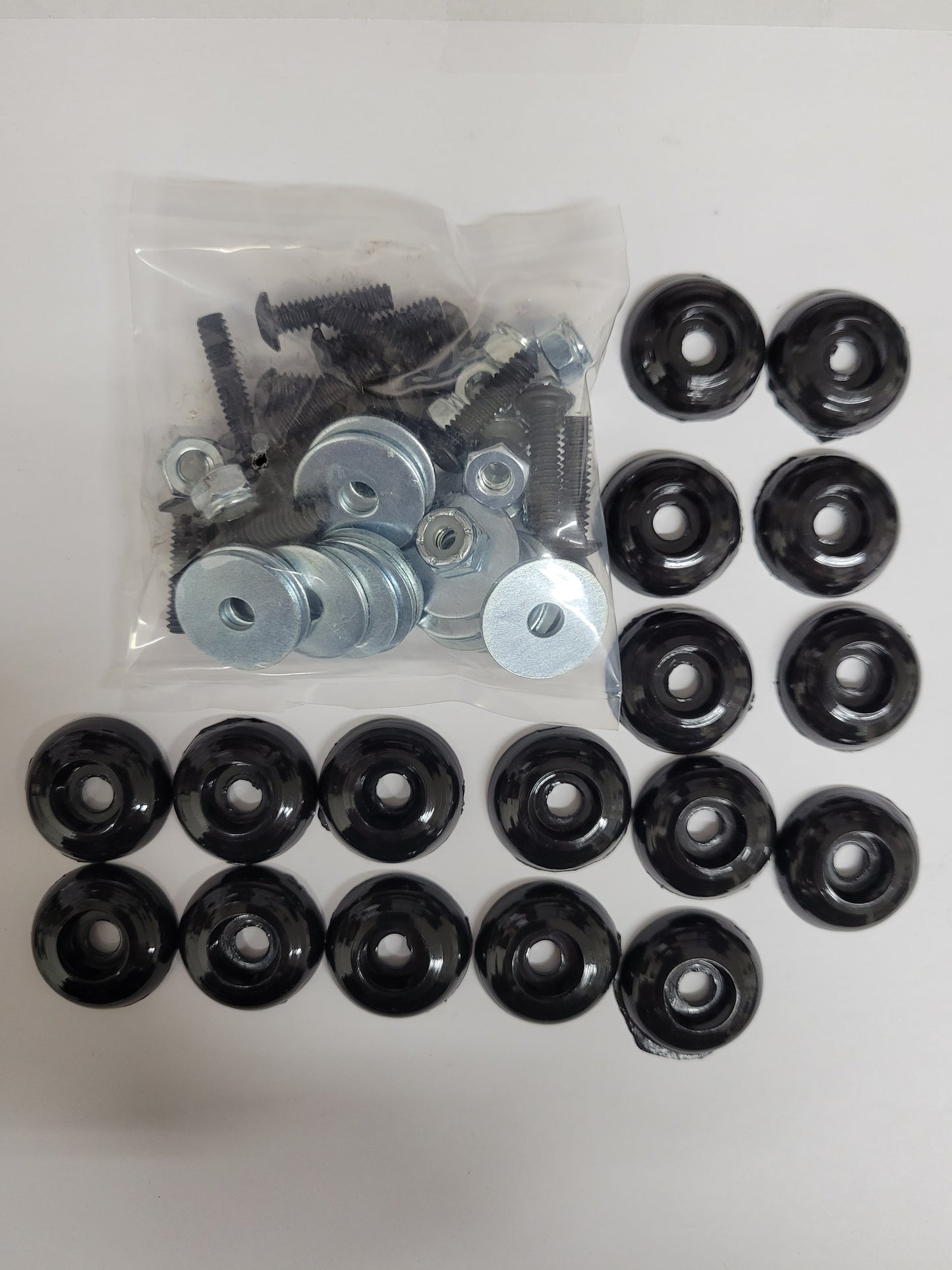 Black plastic body mounting kit components for karts
