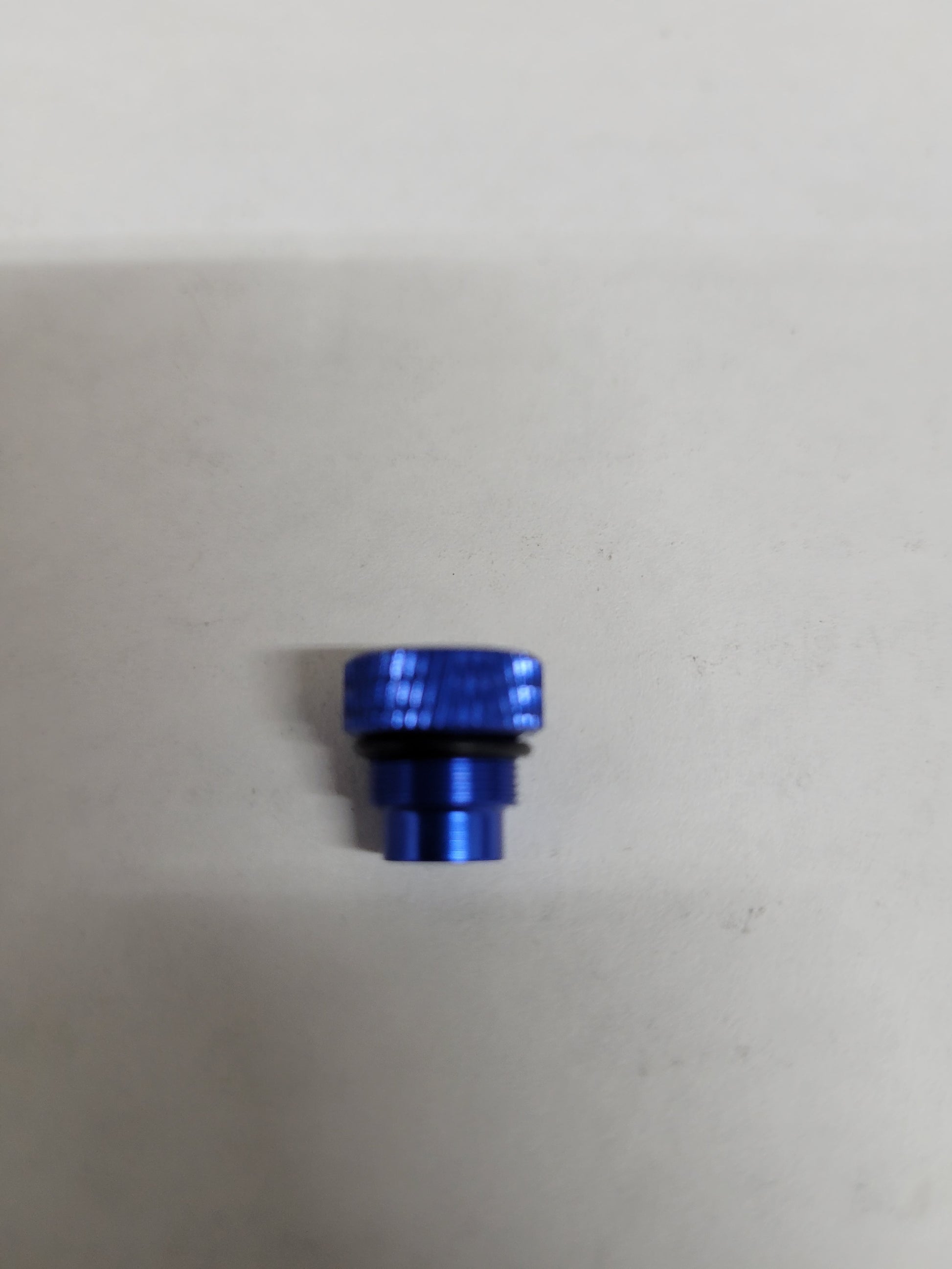 Blue anodized aluminum port plug featuring O-ring seal for Mychron 5
