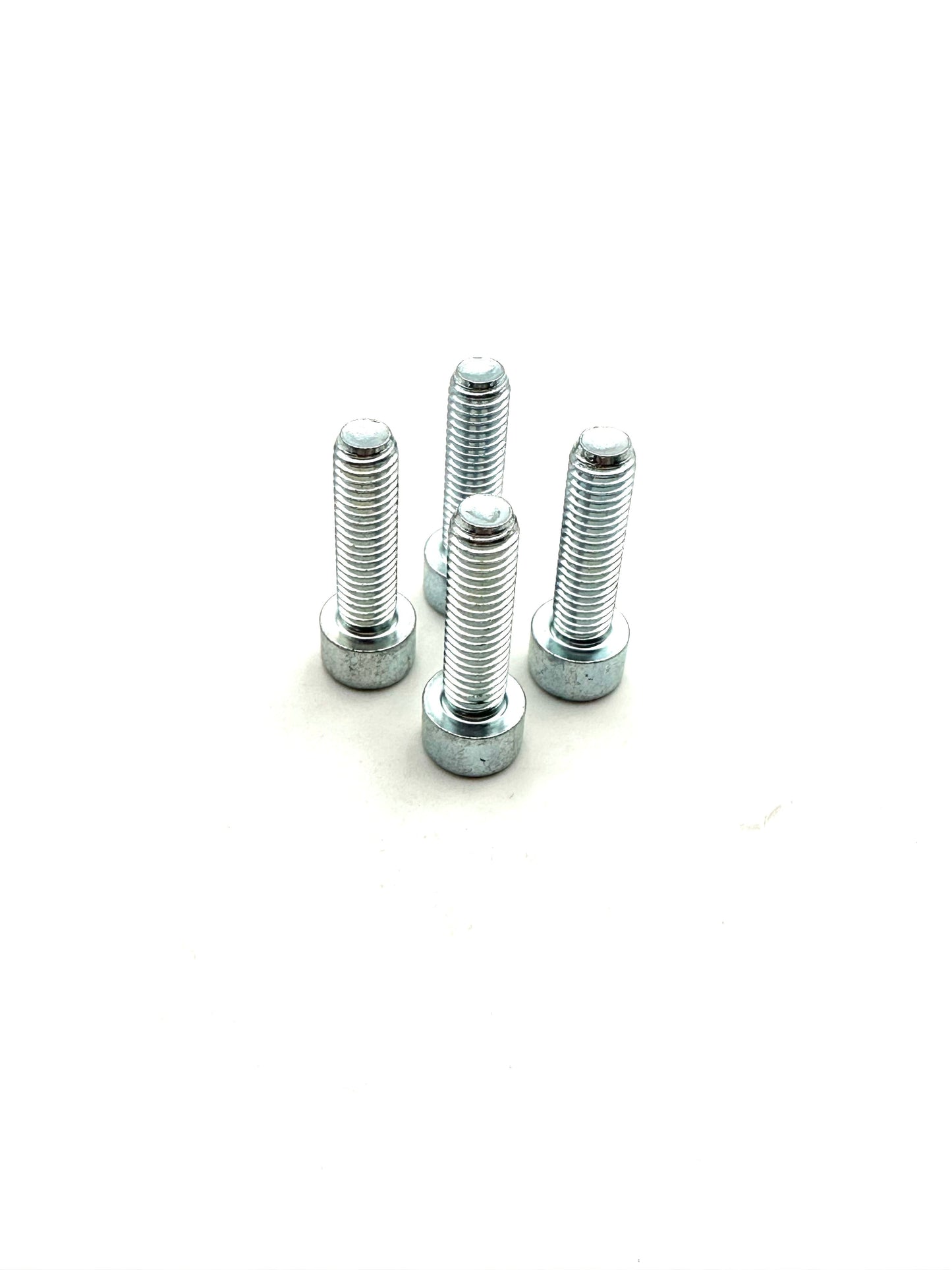 Four silver steel bolts of varying lengths arranged on a white background showing threaded sections and flange bases