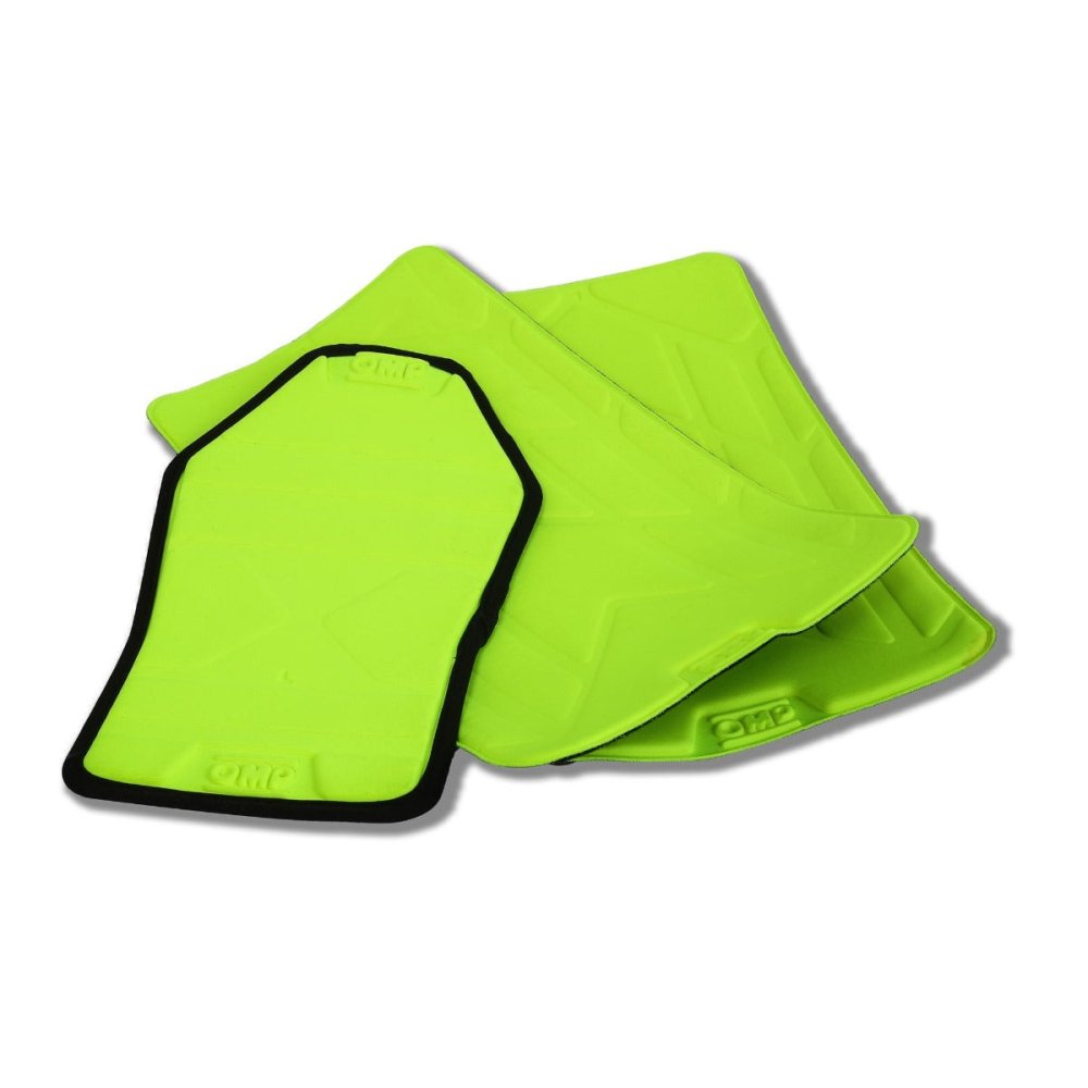 Two bright green pads, that say OMP on them, with black edges on a white background. These are the high quality materials that OMP uses for high safety rating.