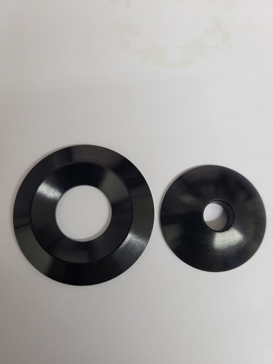 Black anodized self-aligning seat washer assembly with concave and convex pieces