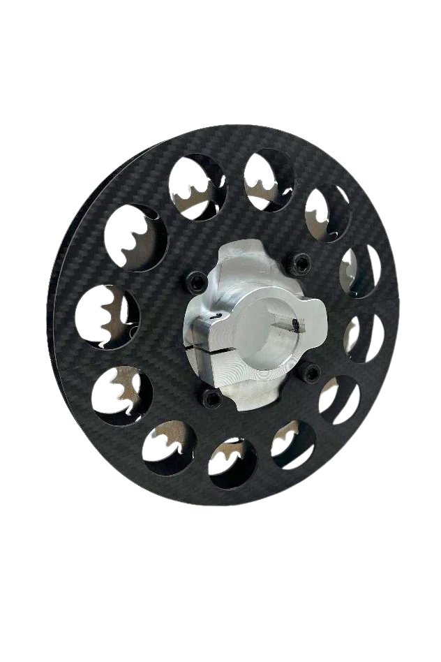 Lifestyle photo of mini sprocket hub assembled with carbon fiber sprocket guard and ultra-light sprocket on black background
