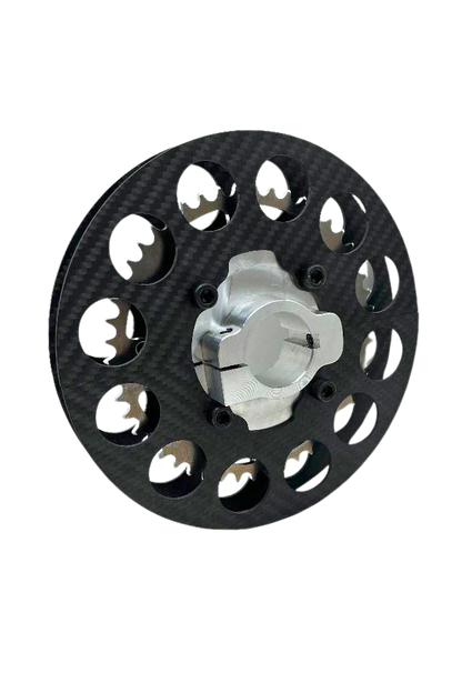 Lifestyle photo of mini sprocket hub assembled with carbon fiber sprocket guard and ultra-light sprocket on black background