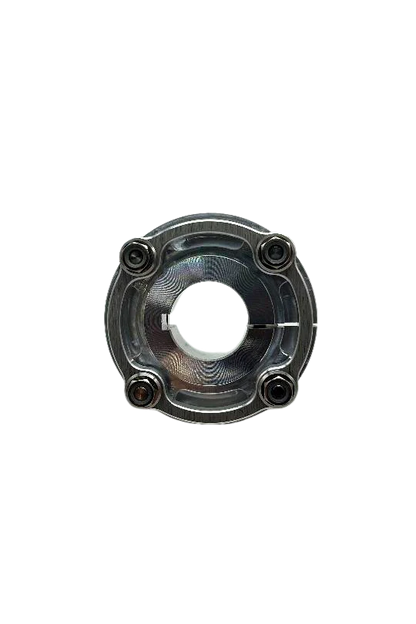 Top-down view of mini sprocket hub face highlighting machined 7075 grain pattern and four sprocket mounting holes on black background