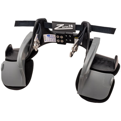Z-Tech Series 2A black and gray head and neck restraint front view with central logo plate, dual gray arms, adjustment screws and belt channels on a white background