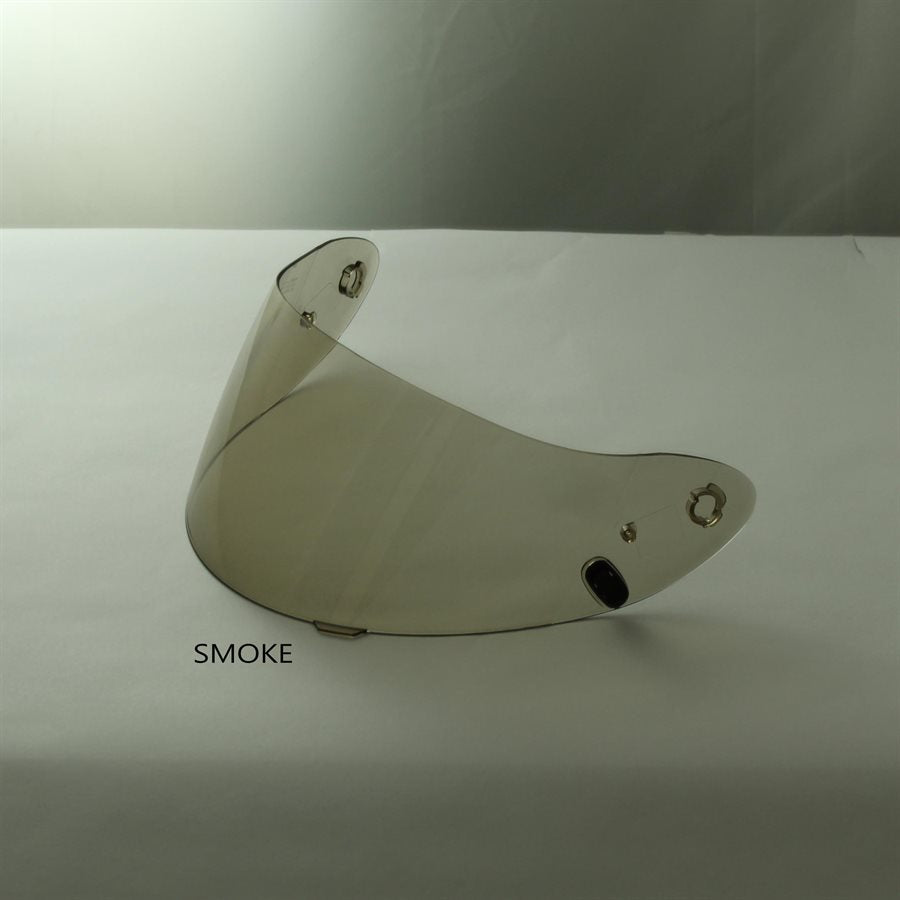 Smoke tinted Z-19 helmet shield propped on white surface labeled SMOKE with visible screw holes and attachment points on a white background