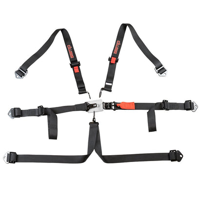 Zamp 6 point harness fully assembled with visible red Zamp logos on black shoulder straps and orange buckle release on a white background