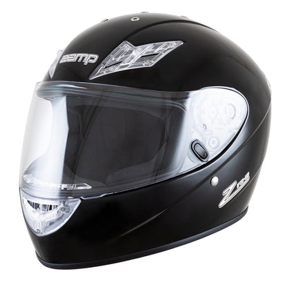 Solid gloss black Zamp FS10 helmet with prominent clear top vent insert, Zamp logo on the crown, and minimal badging on a white background