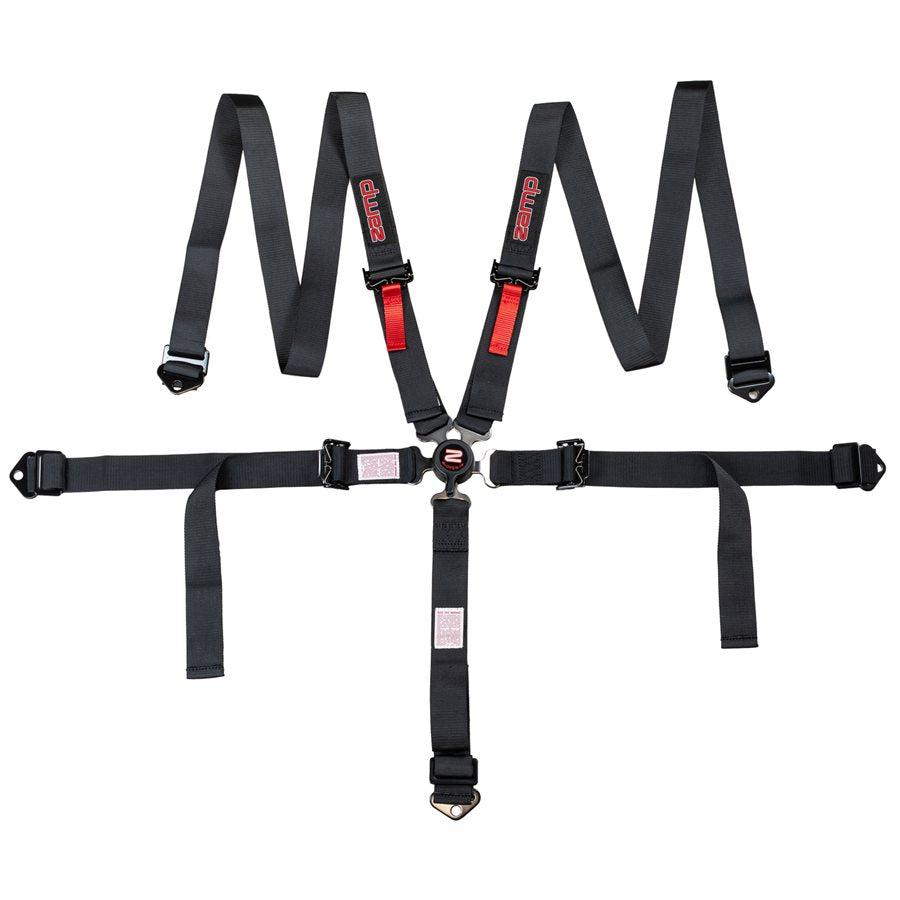 Full overhead layout of Zamp youth black 5 point kart harness showing shoulder straps with red logos, lap belt, and crotch strap connected to central camlock on a white background