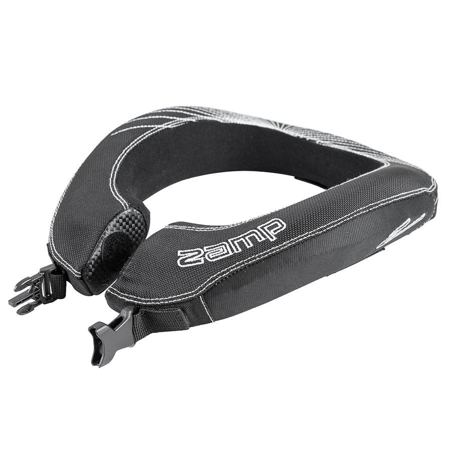 Side profile of opened Zamp youth racing neck collar revealing padded depth, carbon fiber style patch, dual buckle straps and shoulder contour on a white background