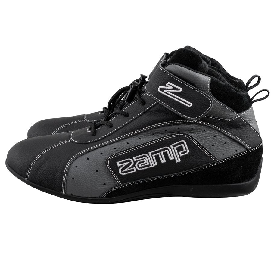 Black Zamp ZK-20 kart racing shoe in side profile view showing perforated gray panel, embroidered Zamp logo, and slim silhouette on a white background